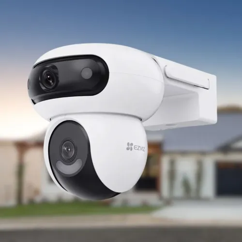 EZVIZ H90 dual-lens pan-and-tilt Wi-Fi camera in white, the fixed wide lens above the moving lens, against a blurred house exterior