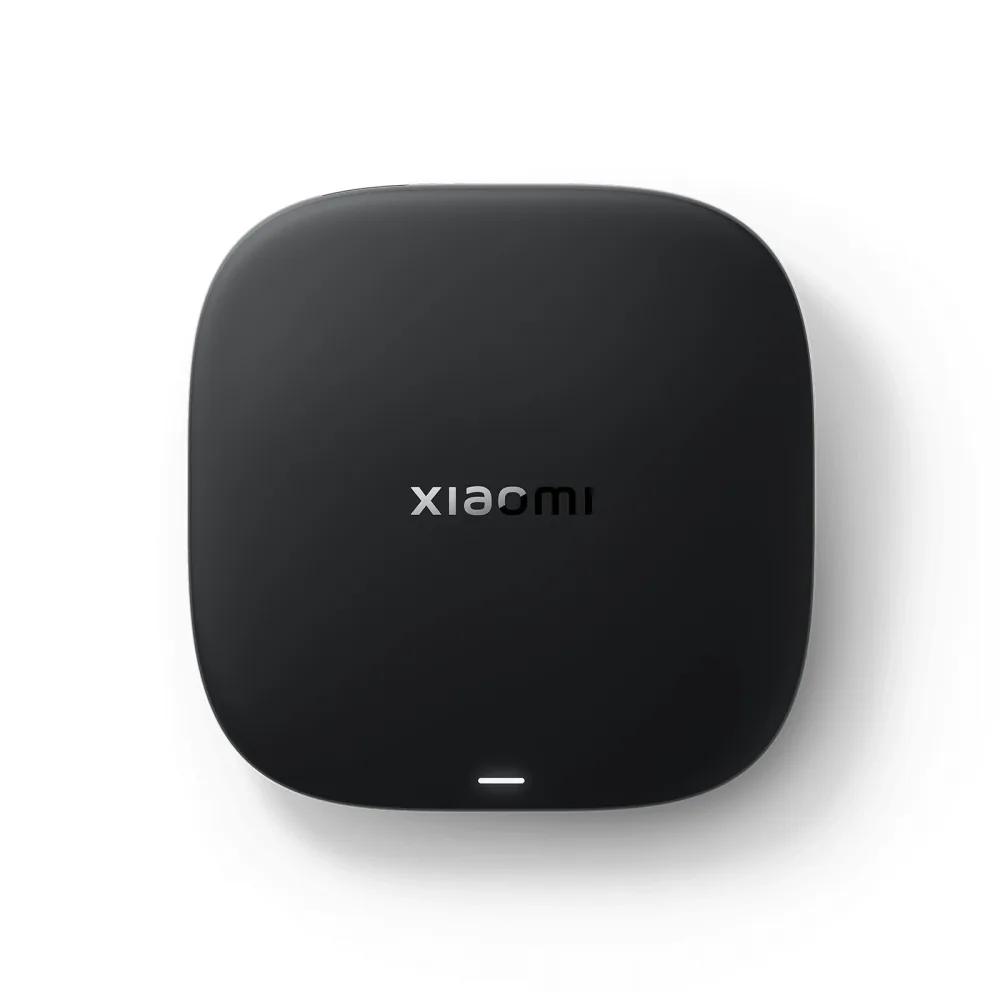 Xiaomi TV Box S 3rd generation 4K streaming box in matte black, angled top view on a white background with the Xiaomi wordmark on the lid